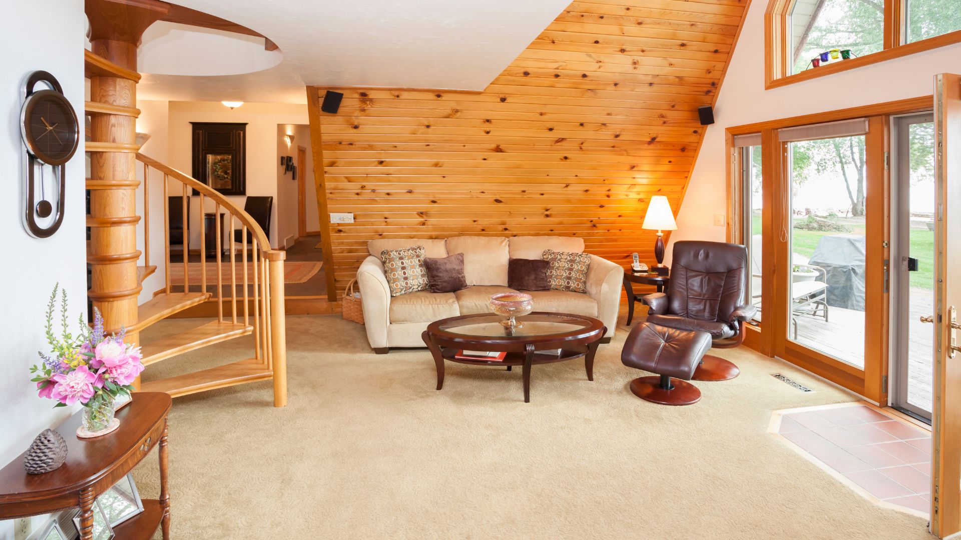 A living room filled with furniture and a spiral staircase